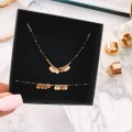 naszyjnik stal 316 l choker czarne koraliki zawieszki kółeczka z gwiazdką kolor złoty.jpg